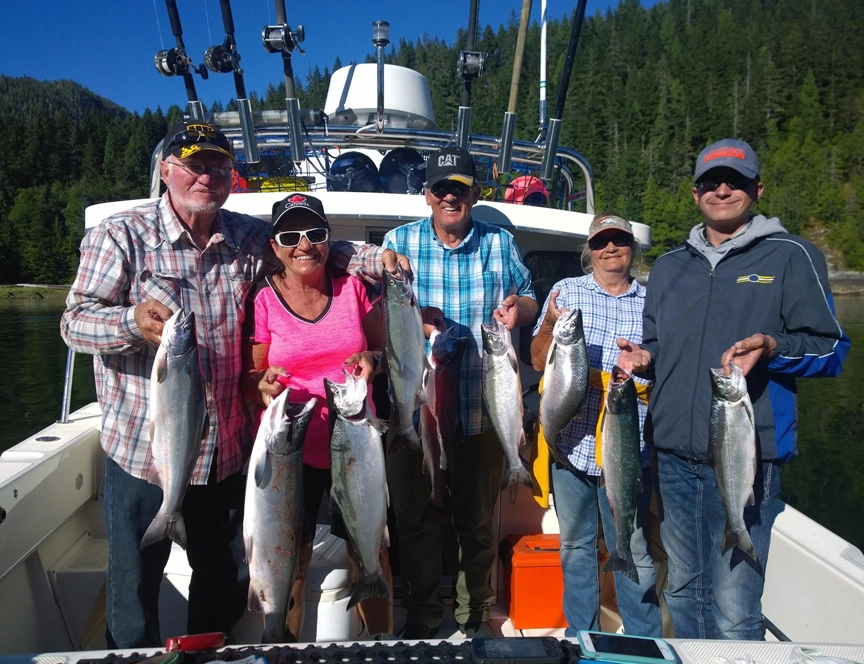 Fishing and catching Coho salmon along with Dungeness crab under sunny skies and a 30 °C temperature.